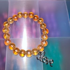 Orange love charmed beaded bracelet